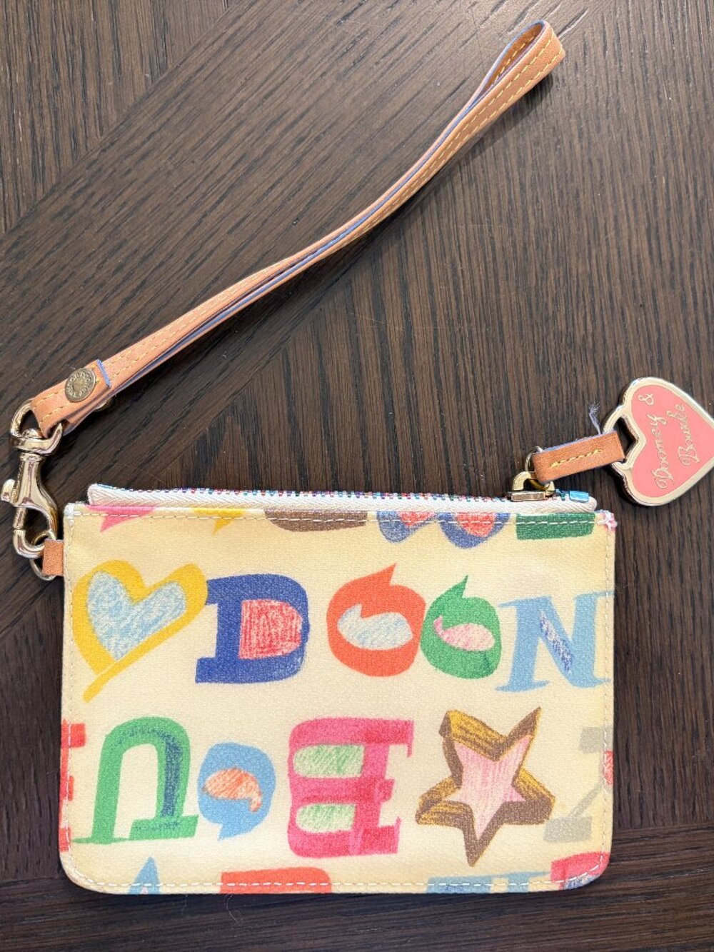 White Dooney & Bourke Wristlet with Multicolored Decor